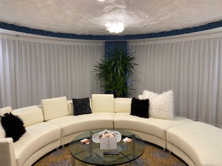 The Presidential suite with grey shade window drapes