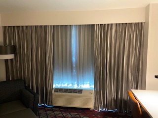 Hotel room with stylish window drapes